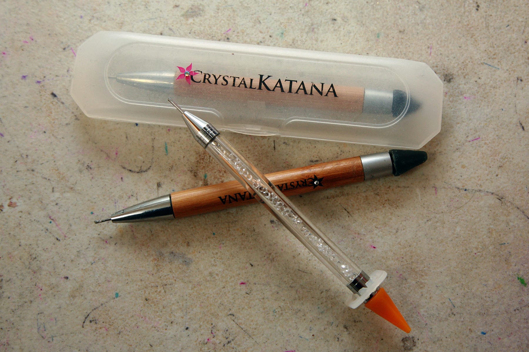 2 Crystal Katanas and an off-brand wax stick, used for crystalling spandex costumes.