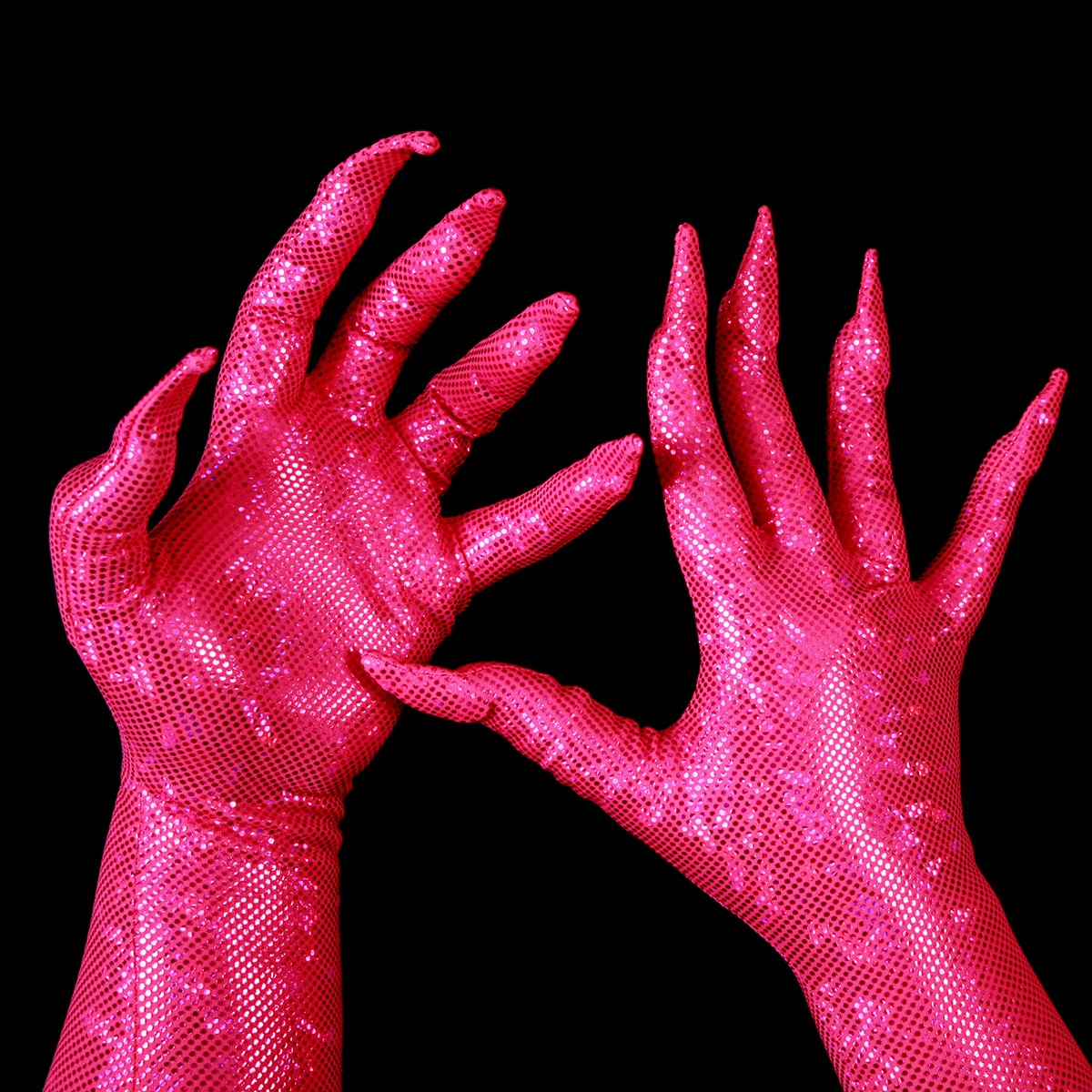 Two hands are shown wearing sparkly hot pink gloves, with built in claws.