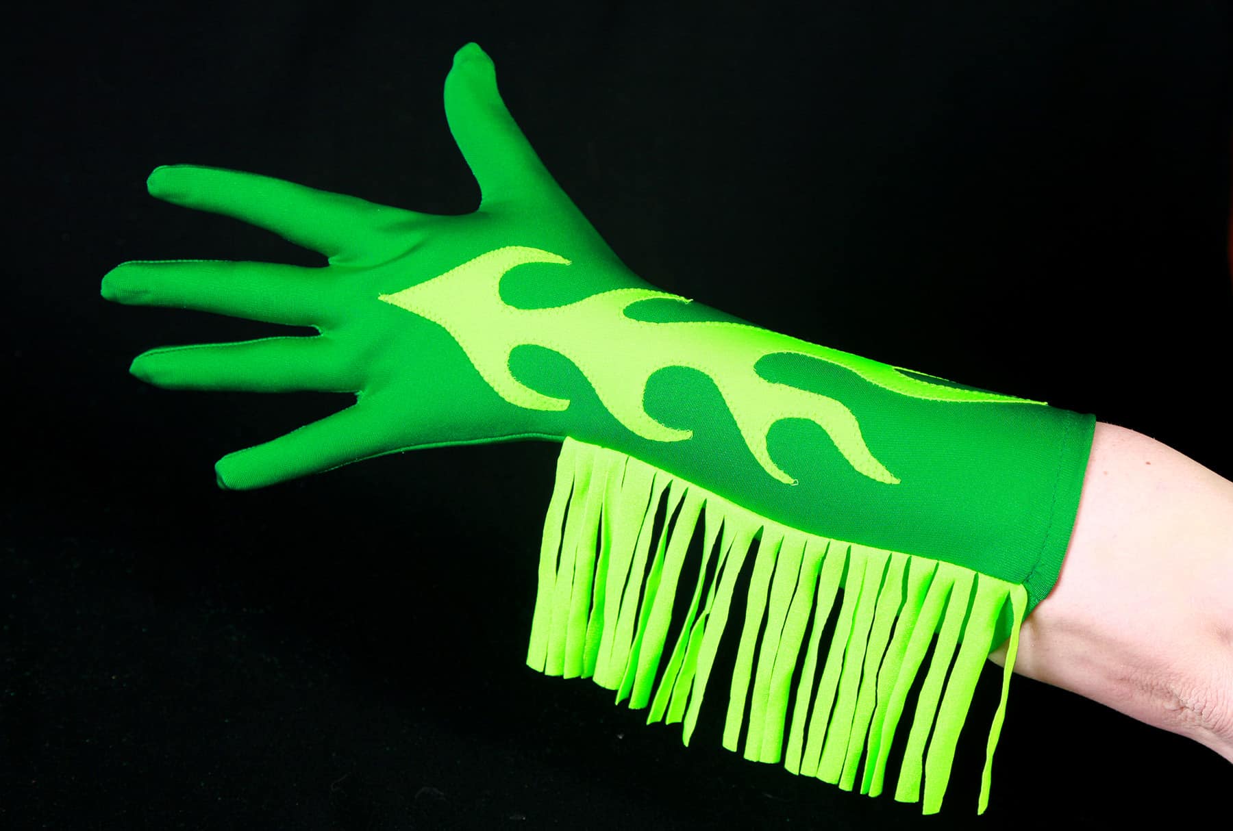 A dark green glove with bright green finge up one side, and a bright green appliqued flame design up the middle.