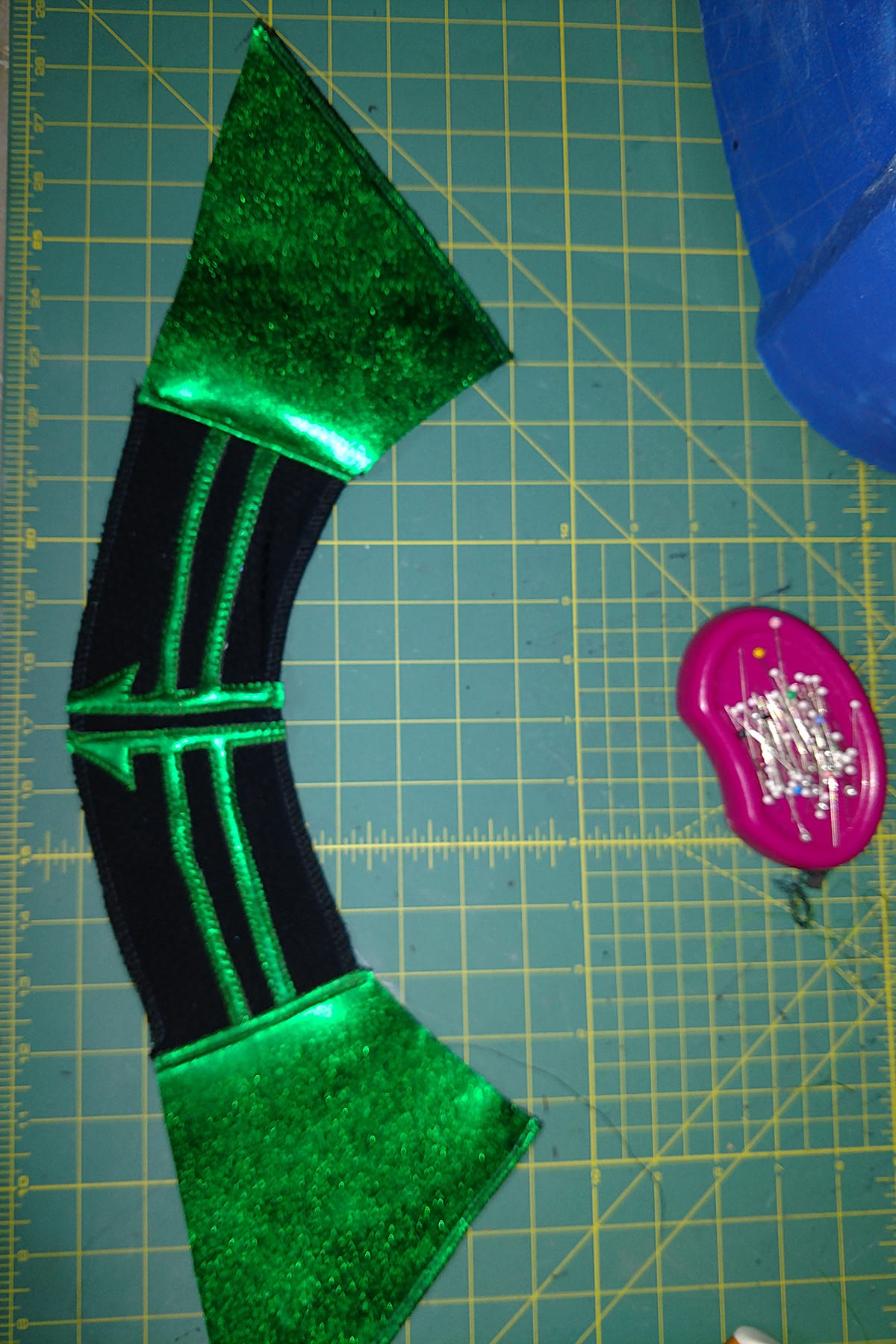 An intricately sewn green and black collar piece for a Hela costume.