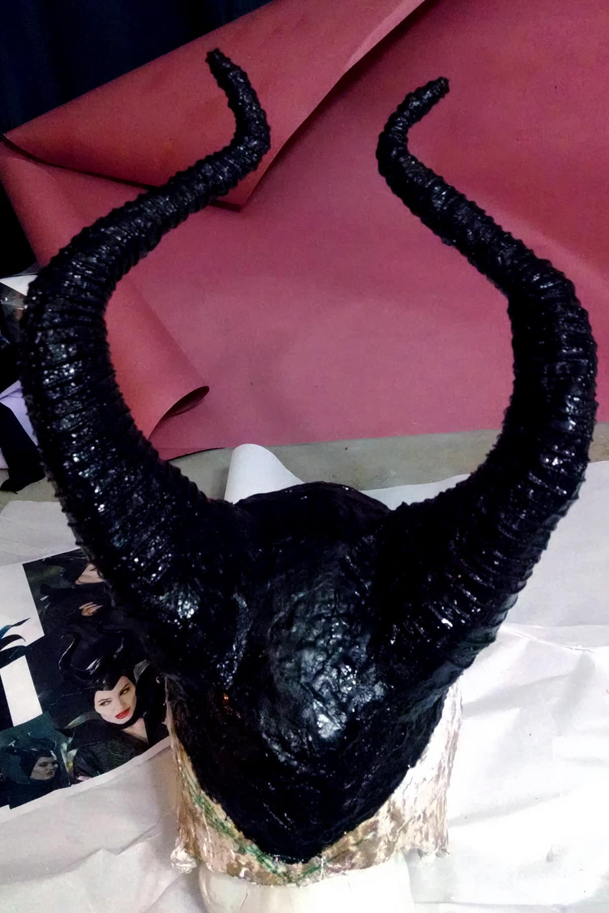 Maleficent's headpiece and horns have been completely coated in shiny black paint.
