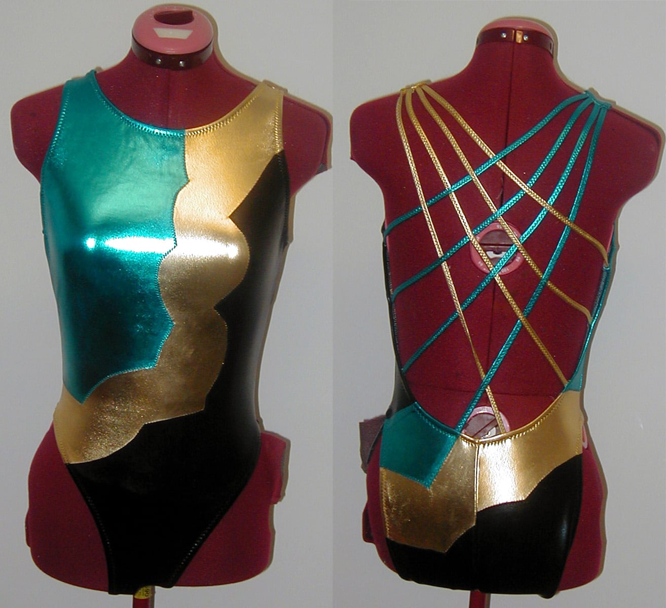 Front and back views of a shiny blue, gold, and black synchro swimsuit.