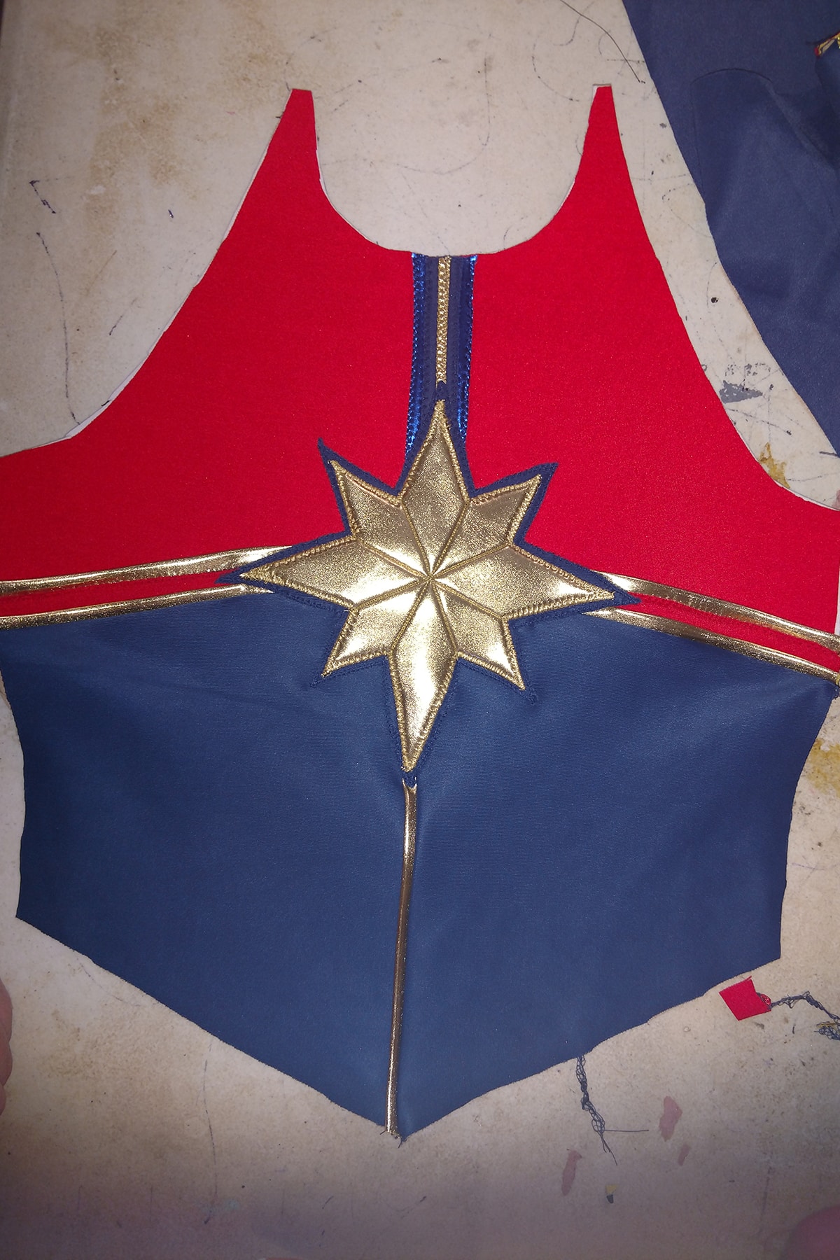 The padded star applique sewn down to the Captain Marvel costume.