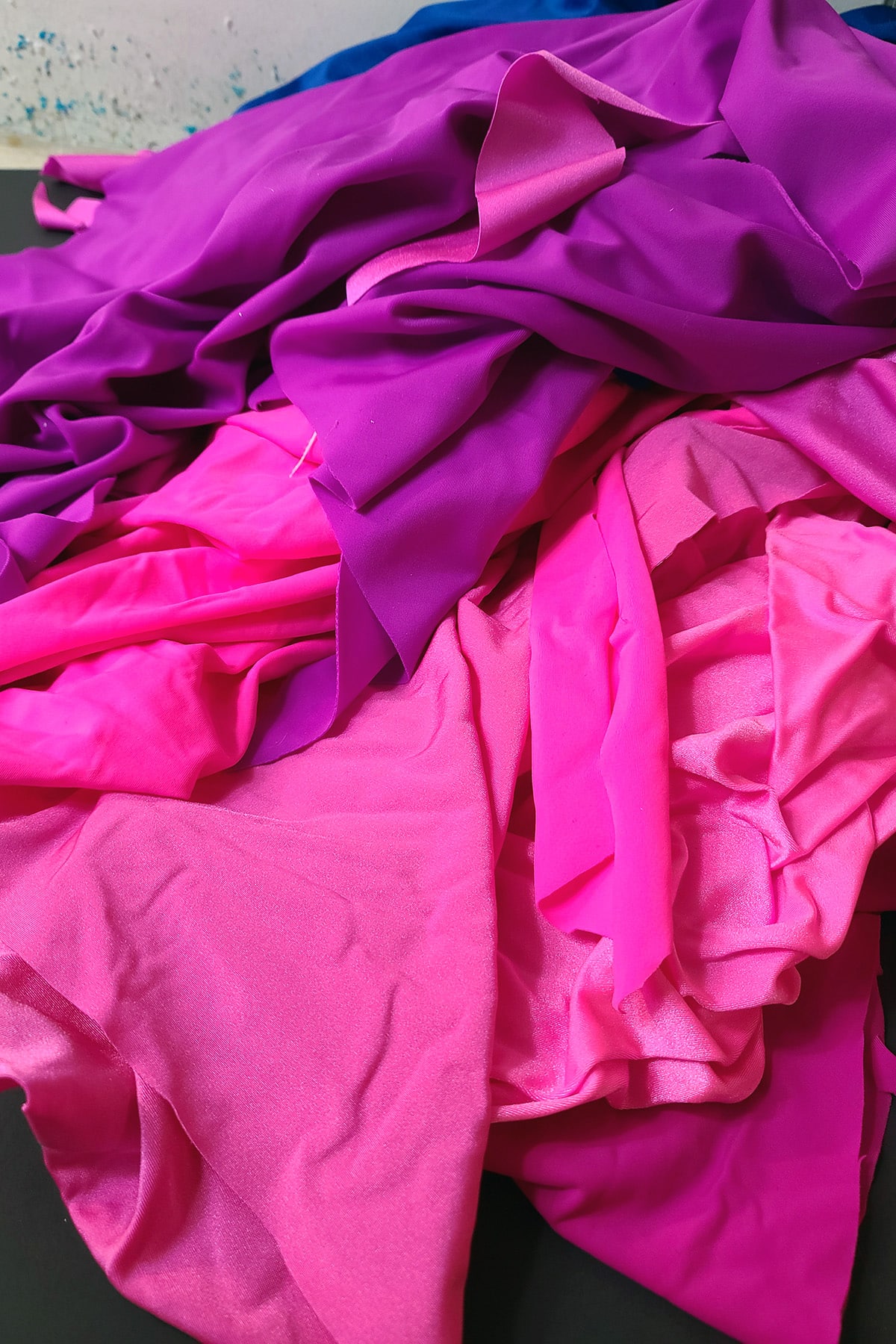 A pile of nylon Lycra® in various shades of pink.