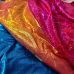 Several styles of brightly coloured hologram lycra.