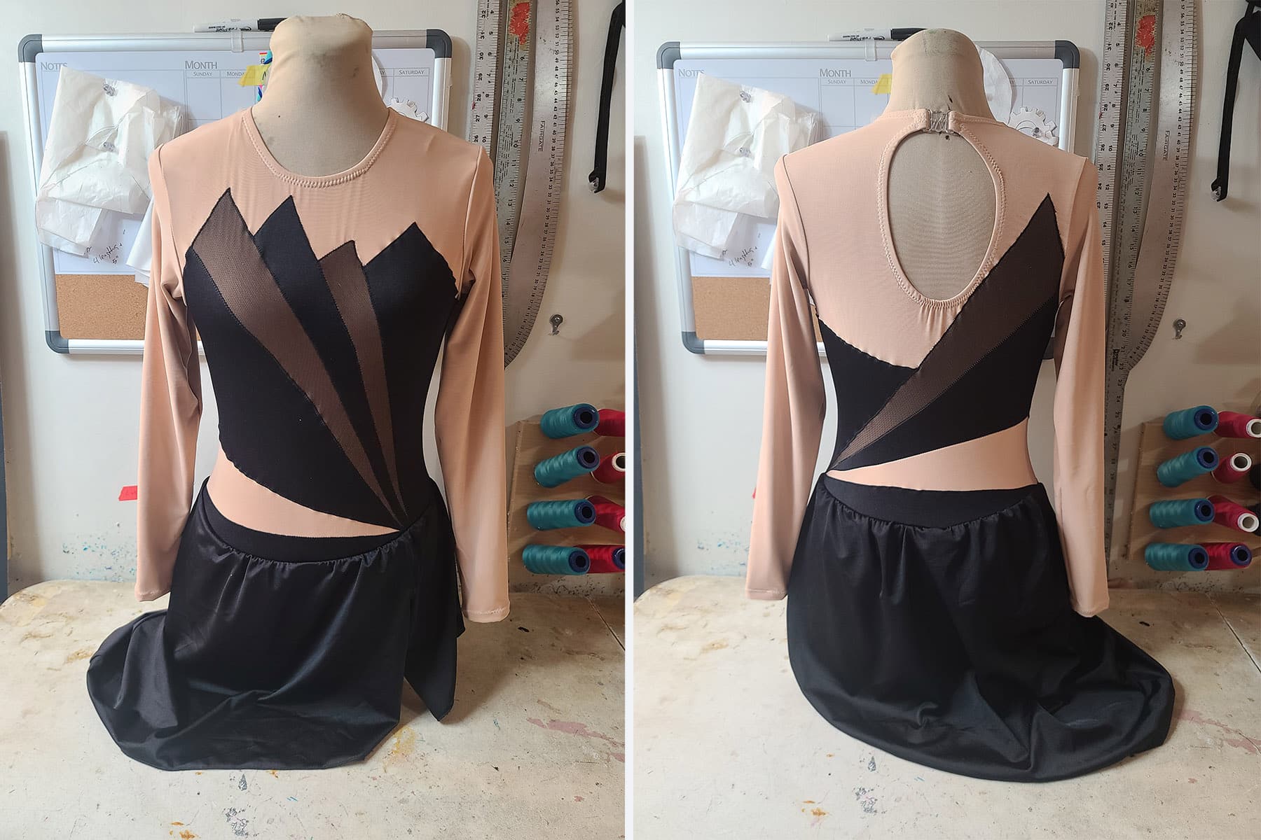 Front and back views of an art deco inspired skating dress. It’s black with black mesh inserts.