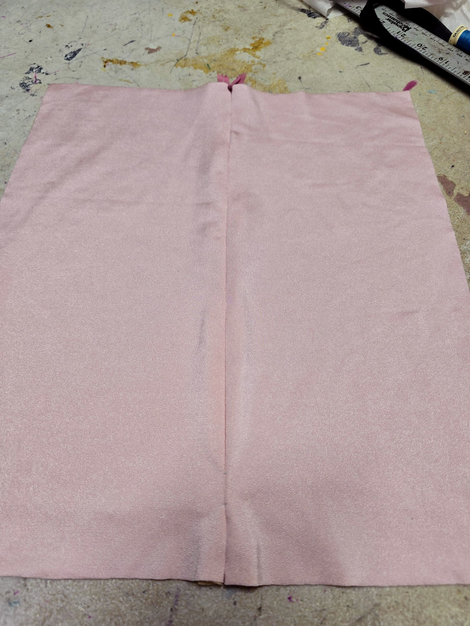 2 pieces of pink spandex with an invisible zipper sewn into them.