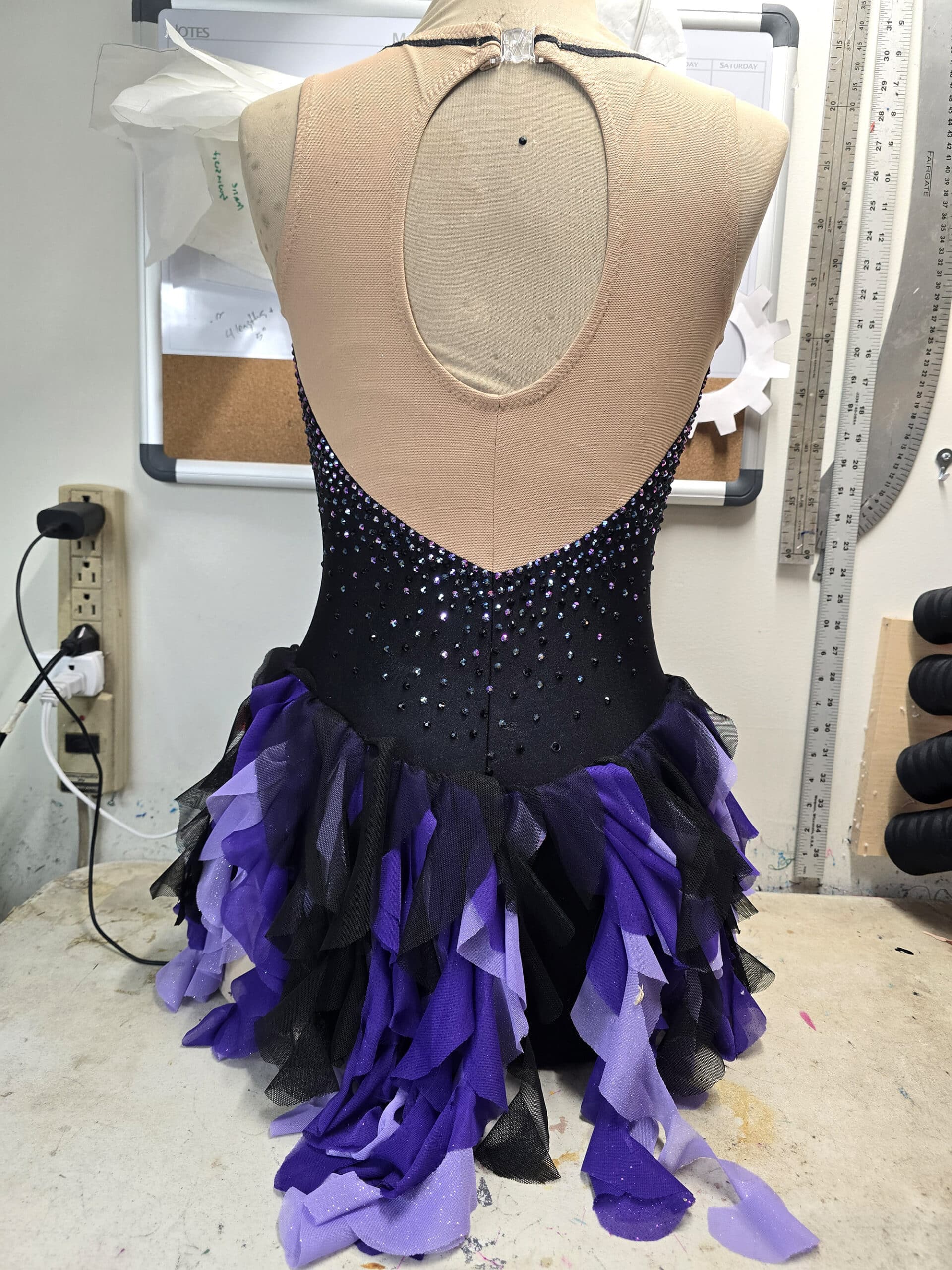 The back view of the ursula dress on a mannequin.