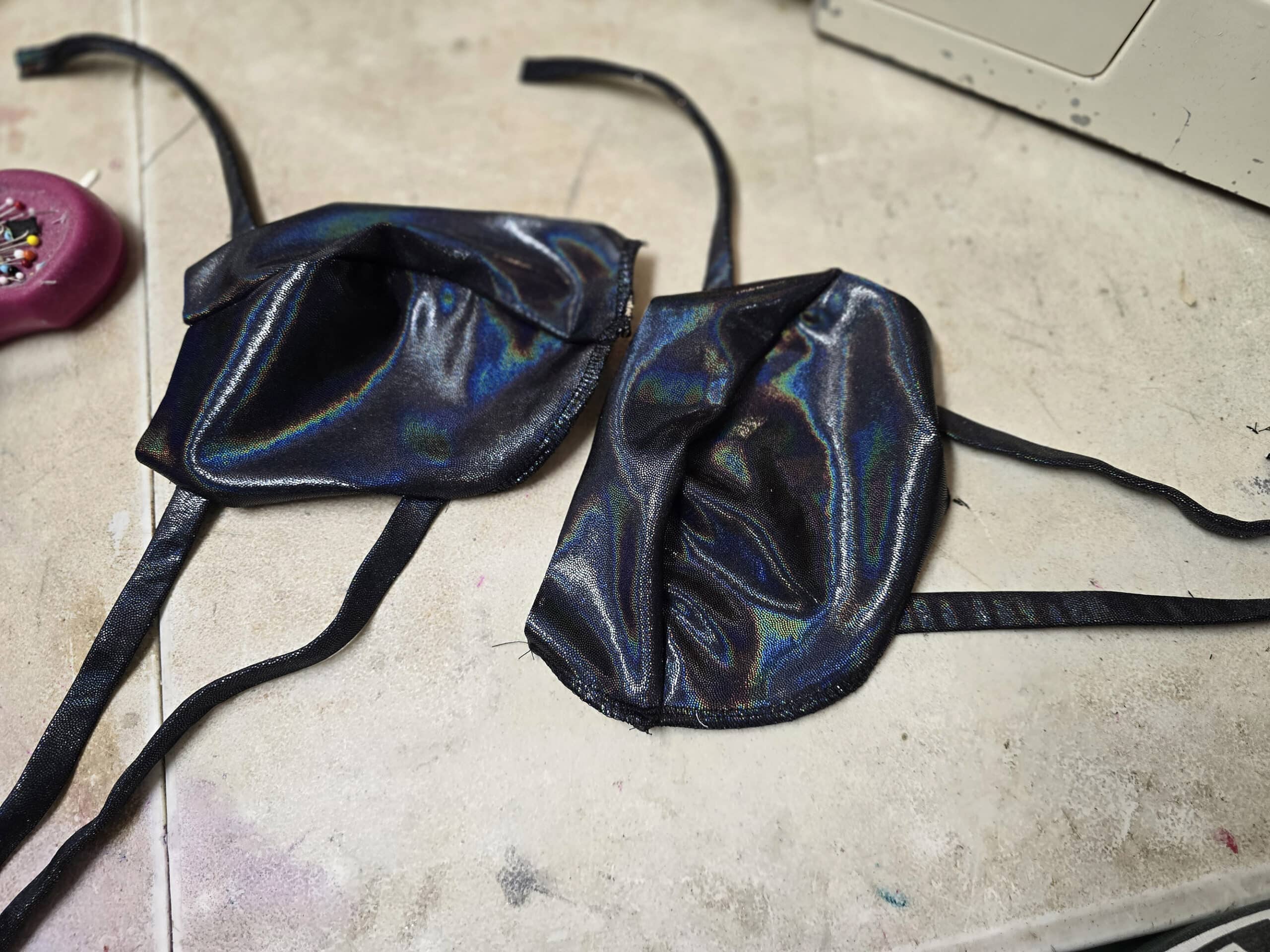 the two bikini cups with straps sewn to the sides and top.