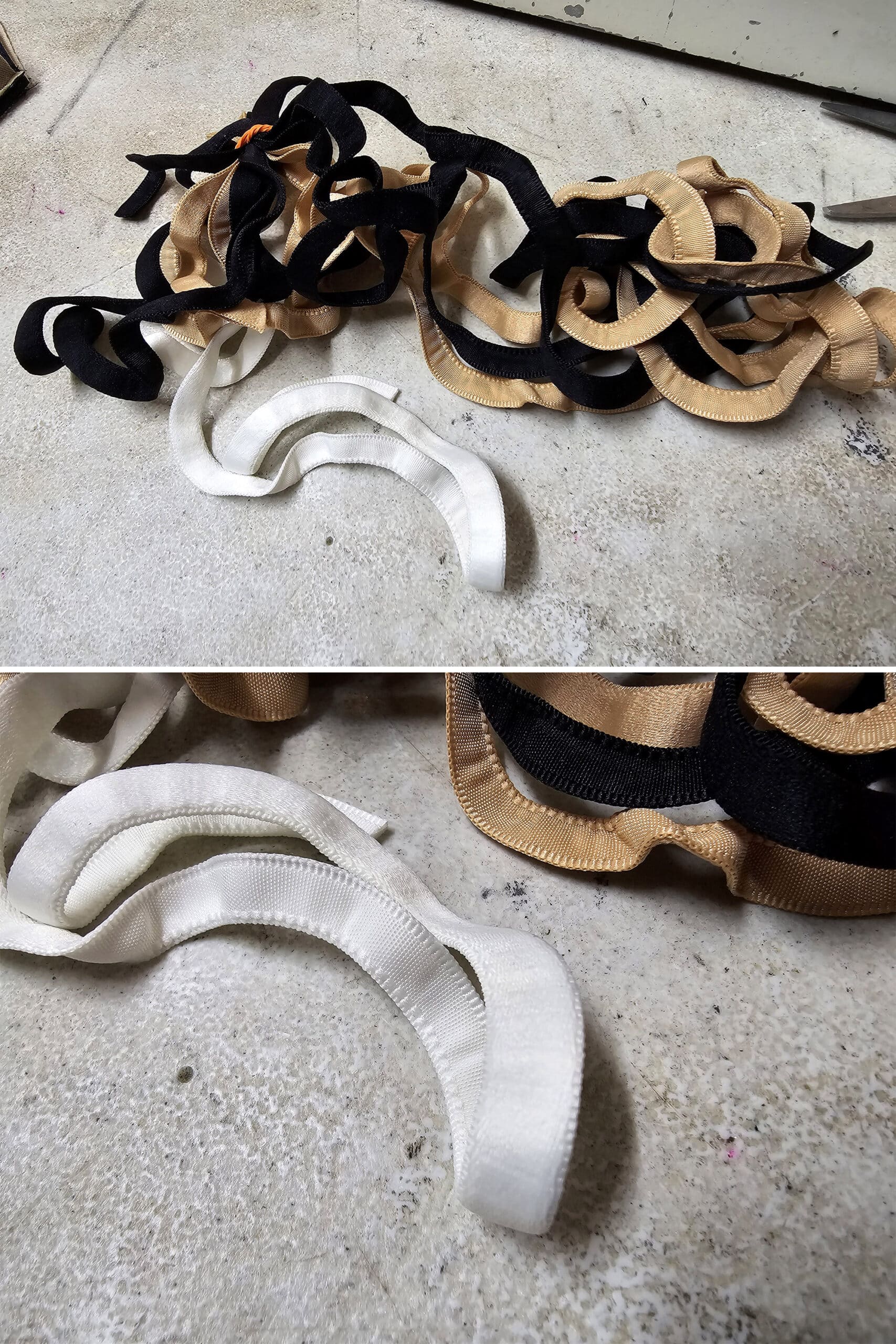 A pile of underwire channelling in white, beige, and black.