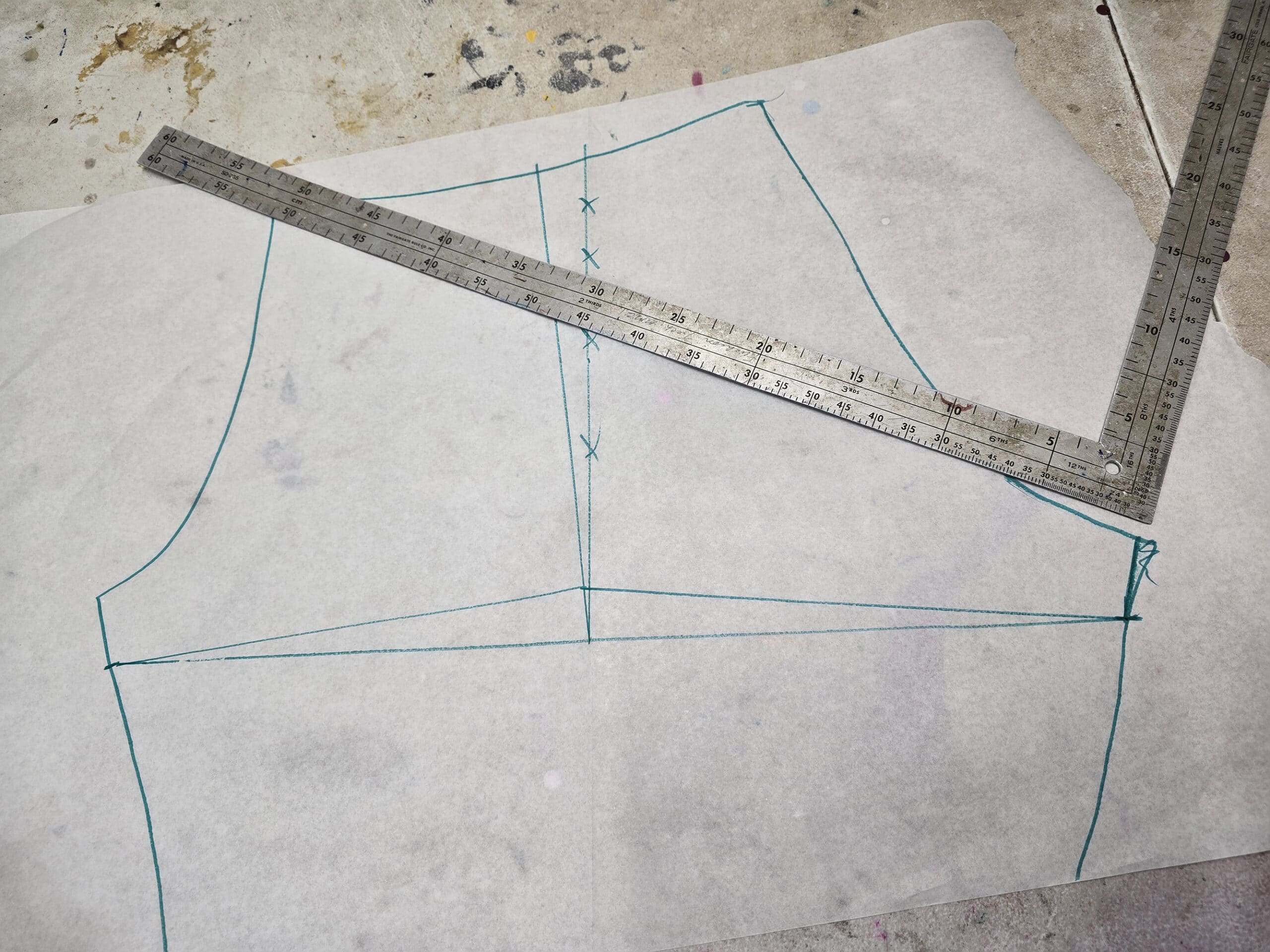A homemade booty shorts pattern on a sewing table.